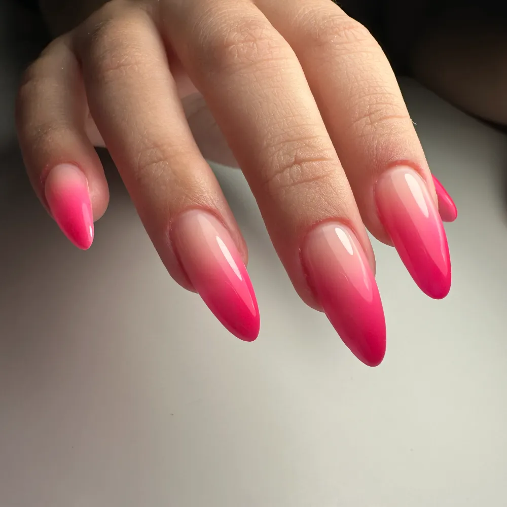Long almond extensions in a hot pink ombre